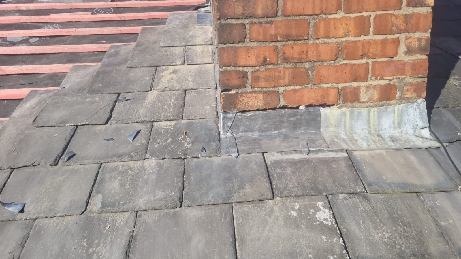 Example of properly dressed leadwork for chimney flashing.